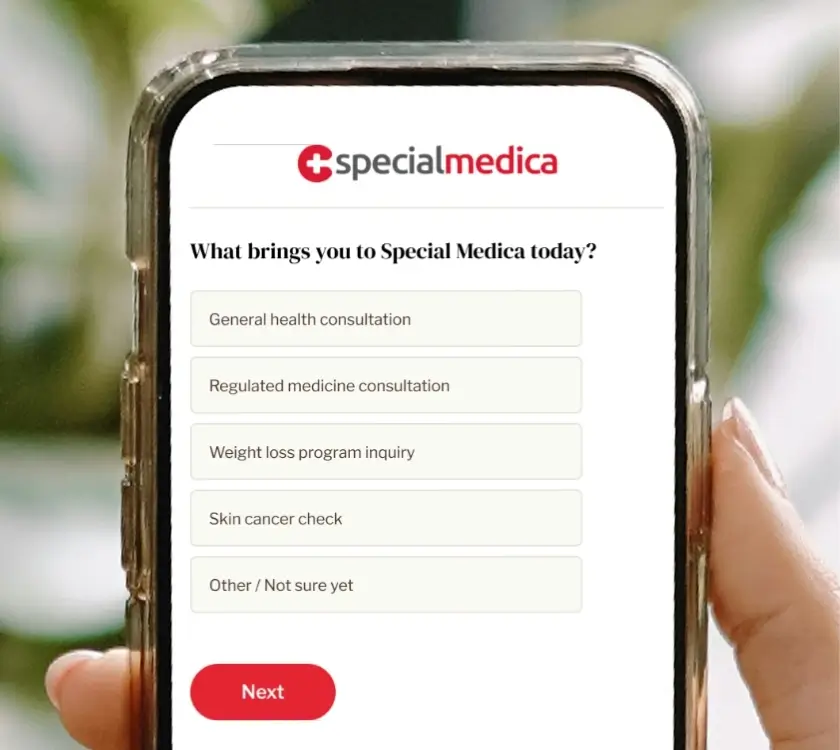 A hand holds a phone displaying the Special Medica app with options for different medical consultations and a red "Next" button at the bottom.